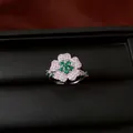 Macro view of a luxury floral ring set with sparkling green and white zircon stones - Ring / Silver-Green