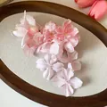 Detailed macro view of an elegant pink fabric floral hair clip with silk petals - Duckbill Clip (1#) / Pink