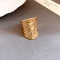 Detail shot of a wide gold statement ring featuring unique geometric cracked patterns - Irregular Geometric Wide Ring / Gold