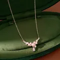 Close-up of elegant necklace with pink pearls and teardrop zircon in green velvet box. - Teardrop Pendant / Silver Pink