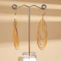 Detailed view of elegant gold-tone oval tiered pendant earrings with zircons - Gold Oval Nested Zirconia Design (1#)