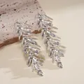 Close-up view of vintage silver leaf-shaped drop earrings featuring a unique molten metal texture - Bionic Leaf Lava Texture Style (10#)