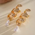 Close-up of vintage gold spiral earrings with irregular baroque pearl pendants - Gold Spiral White Baroque Pearl Style (14#)