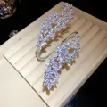Detailed macro shot of sparkling zircon leaf layers on a silver open cuff bracelet - Silver
