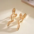 Elegant gold-tone wavy irregular stud earrings with a minimalist artistic polished finish. - Gold Irregular Wavy Streamlined Design (66#)