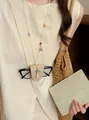 Beaded starfish necklace with woven glasses holder pouch in beige - Off-White