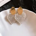 Elegant vintage oval stud earrings featuring a white hollowed-out heart-shaped dangle - Gold Oval White Heart Hollow Design (36#)