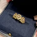 Close-up detail of a 14k gold-plated ring featuring zircon-encrusted star motifs - Round Star Finger Ring (HR2768) / Gold