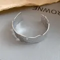 Close-up of irregular silver cuff bracelet with hammered texture and pleated edges. - Crumpled Texture Open Style (HB4686) / Silver