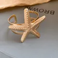 Detailed close-up of a golden starfish open cuff bracelet with intricate textured surface - Sea Star Shape Style (HB5609) / Gold