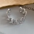Detail shot of a minimalist silver open cuff bracelet with irregular spiral patterns - Spiral Hollow Style (HB5607) / Silver
