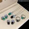 Set di gioielli vintage con zircone ovale e dettagli in piuma argentata. - Set di gioielli
