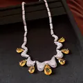 Macro view of high-end vintage court style necklace featuring yellow water drop zircons - Silver-Yellow