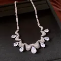 Elegant waterdrop cubic zirconia necklace with intricate wavy pave-set vintage design detail. - Silver-White