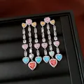 Close-up of vintage tassel earrings with multicolored heart zircons in a jewelry box - Heart Long Tassel Style / Silver Multicolor