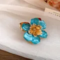 Detailed macro shot of vintage blue enamel flower earring with gold metallic stamen. - Ring / Eco Gold / Blue
