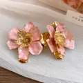 Retro pink oil-drop floral stud earrings with gold-tone metal finish and steel pins - Stud Earrings / Pink