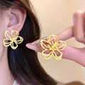 Sweet yellow hollow out flower stud earrings for women featuring a matte finish design - Yellow