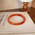 Bracelet jonc en calcédoine orange translucide avec motifs marbrés artistiques - Style 6