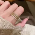 Luxury gold-plated zircon ring featuring a unique triple band wavy design for women - Gold