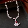 Elegant fan-shaped pendant necklace with red zircon and sparkling stones on a black tray - Necklace-Silver-Red