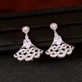 Close-up of elegant fan-shaped dangle earrings with sparkling oval zircons and silver finish. - Silver (Silver Pin)