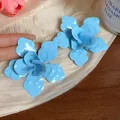 Detailed macro view of light blue enamel flower earrings with glossy layered petals - European Large Flower (HE31791) / Blue
