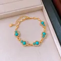 Close-up of gold-plated hulu bracelet with turquoise stones and zirconia in a jewelry box - Style 2 (Silver-Blue) / Silver