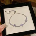 Elegante bracciale argentato con tre quadrifogli in zirconia cubica scintillante - Stile Trifoglio Bianco (8#)