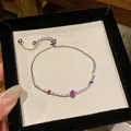 Dettaglio di un braccialetto floreale in argento con zirconi rosa e bianchi lucidi - Stile Fiore Rosso Rosa (6#)