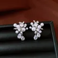 Close-up of elegant silver stud earrings with white pearls and clear teardrop zircons - Silver (Silver Pin)