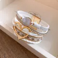 Detailed macro view of white multi-layer bracelet with heart charm and druzy stone - White