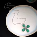 Detailed view of green resin flower pendant necklace with silver adjustable chain - Necklace / Green