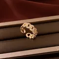 Detailed view of a 14k gold-plated Cuban link open ring with sparkling zirconia stones. - Hollow Chain Open Ring / Gold