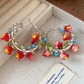 Ethnic style colorful beaded hoop earrings featuring vibrant red and pink flower charms. - Flower Beaded Hoop Style (HE32794) / Silver Pin - Silver - Red