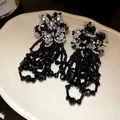 Handcrafted black beaded flower tassel earrings with intricate silver accents - Western Retro Woven Tassel Style (81#)