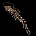 Macro view of gold cascading tassel ear wrap featuring marquise-cut cubic zirconia - Single Piece / Gold