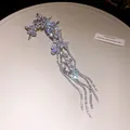 Detail view of sparkly flower tassel ear clip with marquise-cut cubic zirconia stones - Single Piece / Clip-On Earrings / Silver (White)