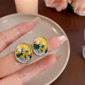 Macro detail of Monet Garden style enamel stud earrings with pearl and floral gold accents - Silver Earring Post - Yellow / Yellow