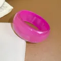 Stylish chunky pink glitter resin bangle with an irregular geometric dome design - Rose Red