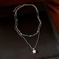 Detailed view of silver double-layer necklace with turquoise beads and star pendant - Stone Style / Silver-Blue