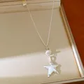 Close-up of silver star necklace with "Promise me" engraving and stone beads detail. - Silver-Star