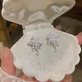 Sparkling full-diamond star drop earrings with cubic zirconia in a white shell jewelry box - Silver