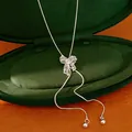 Detailed view of a silver hollow-out bow-knot necklace with an adjustable chain. - Silver Hollow Bowknot Style (HN12570) / 1 Piece