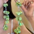 Stunning vintage green iridescent shell petal tassel earrings with pearls on a model. - Silver Post Style (52#) / Green