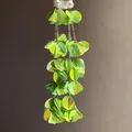 Detail view of vibrant lime green sequin petal tassel earrings with pearl studs - Silver Post Style (51#) / Green