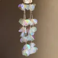 Close-up of long iridescent tassel earrings with shimmering shell-like holographic sequins. - Silver Post Style (49#) / Colorful