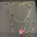 Layered gold-tone necklace set with colorful stones and a cherry pink flower pendant. - Gold-Rose Red-Multicolor
