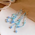 Summer beach style beaded tassel earrings with starfish charms in blue and white - Gold-Blue