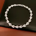 Detail view of a silver leaf-shaped bracelet with marquise-cut cubic zirconia stones. - Bracelet Only / Silver-White